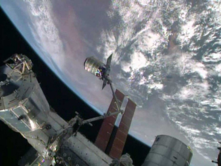 The International Space Station's robotic arm, Canadarm2, grapples the Orbital Sciences' Cygnus cargo craft, as seen in this still image taken from NASA TV July 16, 2014. The Orbital Sciences Corp cargo ship reached the International Space Stati