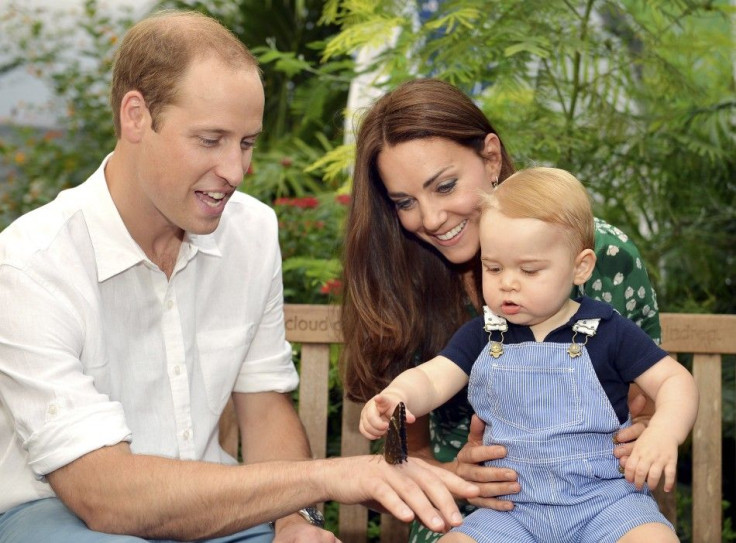 Britain&#039;s Catherine, Duchess of Cambridge, carries her son Prince George as he examines a butterfly on the hand of his father Prince William during a visit to the Sensational Butterflies exhibition at the Natural History Museum in London, July 2, 201