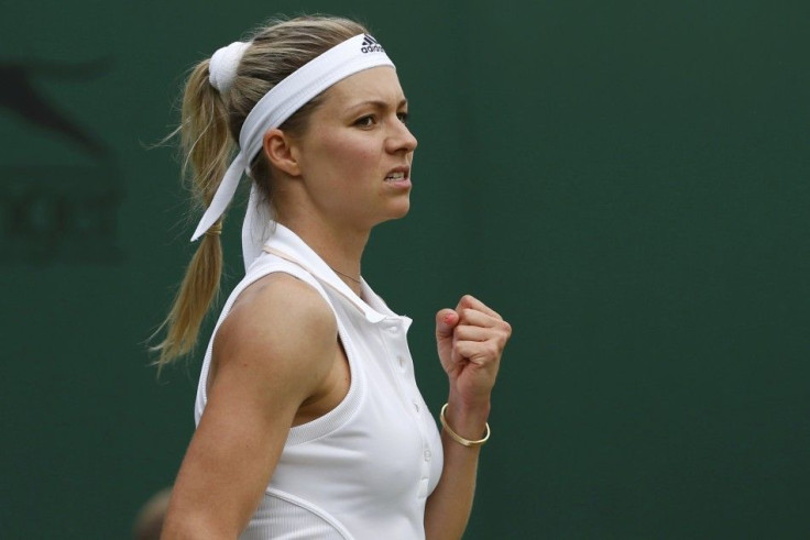 Maria Kirilenko of Russia pumps her fist during her women&#039;s singles tennis match against Sloane Stephens of the U.S. at the Wimbledon Tennis Championships, in London June 23, 2014.