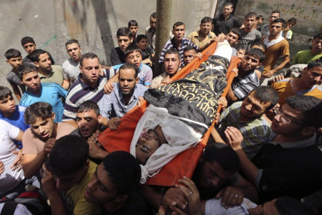 Mourners carry the body of Palestinian Islamic Jihad militant Sweilem, whom medics said was killed in an Israeli air strike, during his funeral at Jabalya refugee camp in northern Gaza Strip