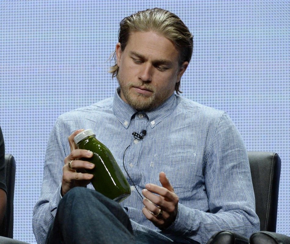 Cast member Hunnam of the drama series quotSons of Anarchyquot shakes his juice as he participates in a panel discussion during FX Networks portion of the 2014 Television Critics Association Cable Summer Press Tour in Beverly Hills