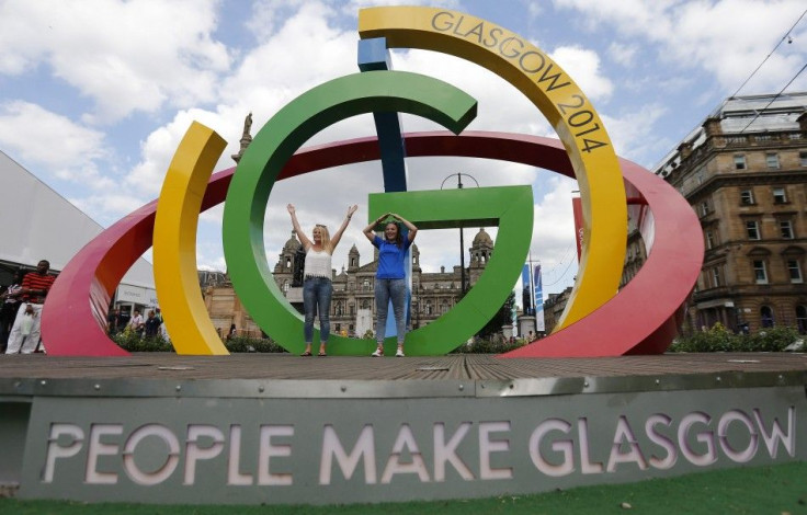 Alicia Steer (L) and Gemma MacLean pose on &quot;The Big G&quot; 3-D structure at George Square in Glasgow, Scotland, July 22, 2014. The opening ceremony of the Glasgow 2014 Commonwealth Games takes place on July 23.