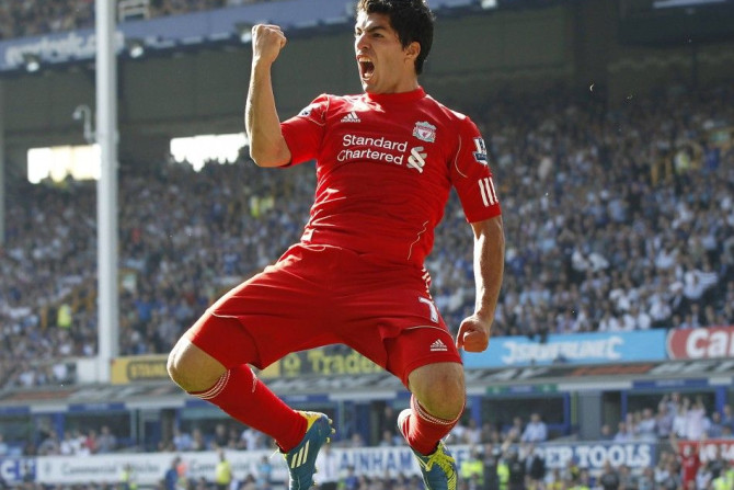 File photo of Liverpool&#039;s Suarez celebrating after scoring during their English Premier League soccer match against Everton in Liverpool