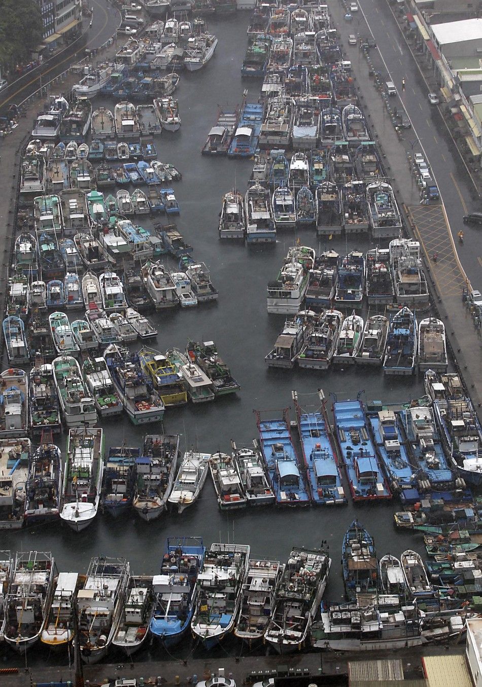 Fishing boats are docked at a harbour as Typhoon Matmo approaches the northeastern coastal town of Nanfangao in Ilan county, northern Taiwan, July 22, 2014. REUTERSPichi Chuang TAIWAN - Tags ENVIRONMENT
