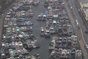 Fishing boats are docked at a harbour as Typhoon Matmo approaches the northeastern coastal town of Nanfangao in Ilan county, northern Taiwan, July 22, 2014. REUTERS/Pichi Chuang (TAIWAN - Tags: ENVIRONMENT)