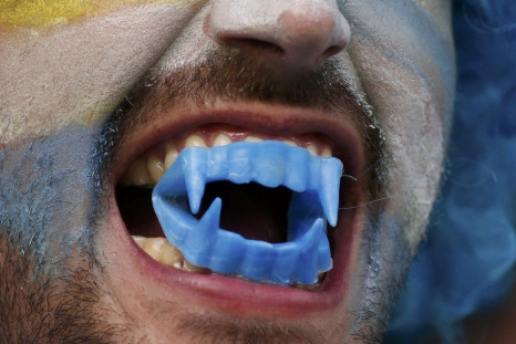 A Uruguay fan bares his teeth before the 2014 World Cup round of 16 game between Colombia and Uruguay at the Maracana stadium