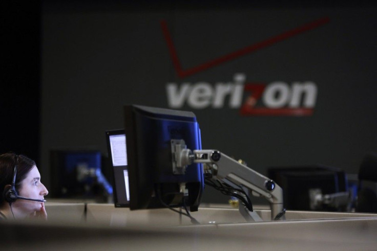 A cybersecurity expert monitors telecommunications traffic at a network operations center in a Verizon facility