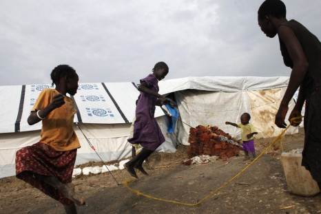 Girls play in an internally displaced persons (IDP) camp inside the U.N. base