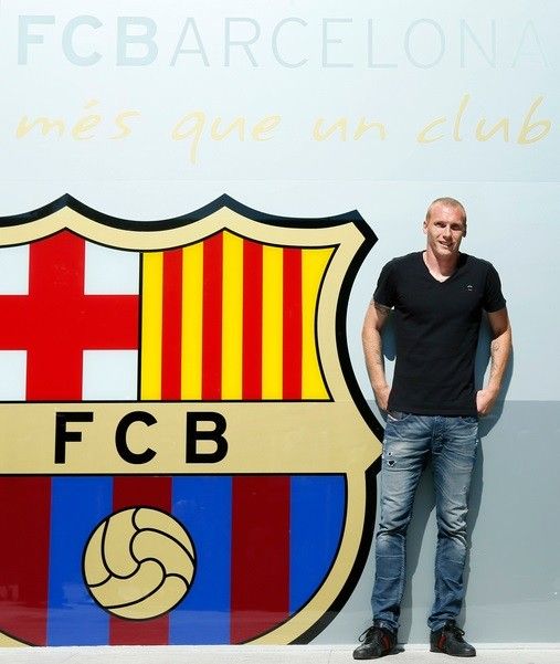 French soccer player Jeremy Mathieu poses for pictures upon his arrival at FC Barcelonas offices in Barcelona