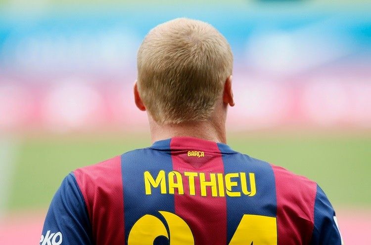 Barcelonas newly signed French soccer player Jeremy Mathieu wears his new jersey during his presentation at Camp Nou stadium, in Barcelona