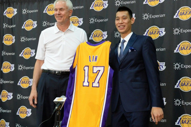 Jul 24, 2014; El Segundo, CA, USA; Los Angeles Lakers general manager Mitch Kupchak introduces Jeremy Lin during a press conference at Toyota Sports Center.
