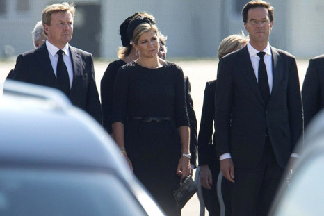(L-R) King Willem-Alexander and Queen Maxima of the Netherlands, and Dutch Prime Minister Mark Rutte attend a national reception ceremony at Eindhoven airport July 23, 2014, for the remains of the victims of Malaysia Airlines MH17
