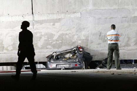 A car is trapped underneath a bridge that collapsed while under construction in Belo Horizonte