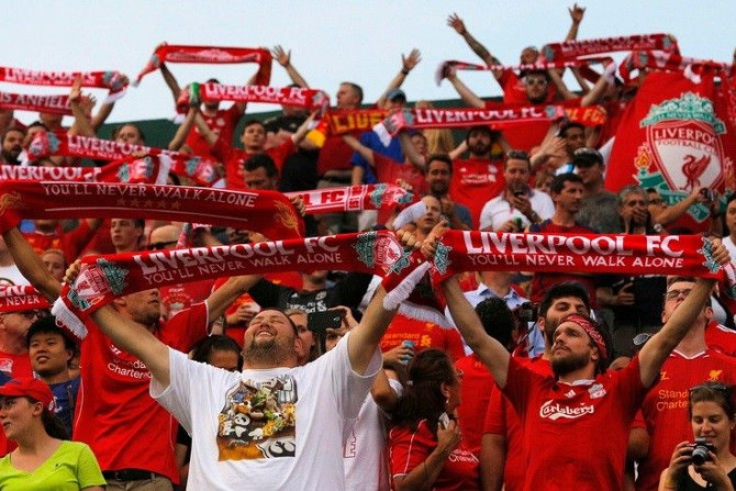 Liverpool fans sing before an international friendly soccer match against AS Roma at Fenway Park in Boston, Massachusetts July 23, 2014. Fenway Park is the home of the MLB baseball team the Boston Red Sox.