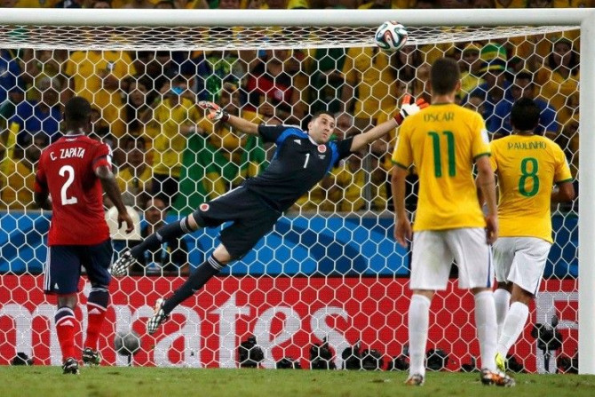 Colombia&#039;s goalkeeper David Ospina fails to stop a goal by Brazil&#039;s David Luiz (not pictured) during their 2014 World Cup quarter-finals at the Castelao arena in Fortaleza July 4, 2014.