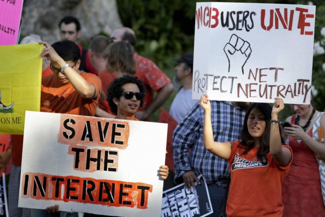 Pro-net neutrality Internet activists rally in the neighborhood where U.S. President Obama attended a fundraiser in Los Angeles, California