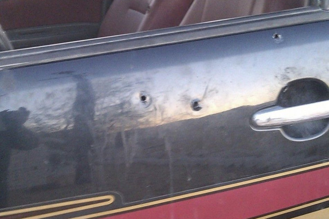 Bullet holes are seen in a car at a checkpoint on the Egyptian border with Sudan and Libya, which was attacked on Saturday, in Wadi al-Gadid governorate July 19, 2014. Gunmen killed 21 Egyptian military border guards near the frontier with Libya on Saturd