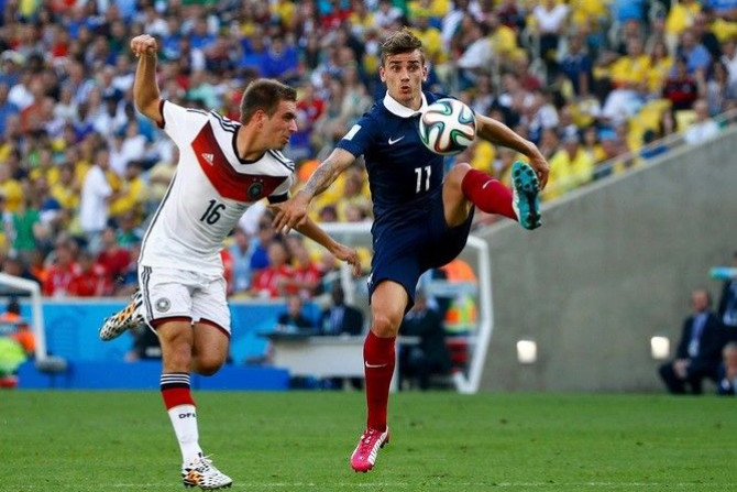 France&#039;s Antoine Griezmann controls the ball next to Germany&#039;s Lahm during their 2014 World Cup quarter-finals at the Maracana stadium in Rio de Janeiro