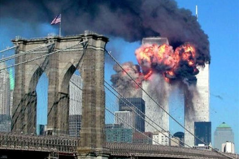 The second tower of the World Trade Center explodes into flames after being hit by a airplane, New York September 11, 2001 with the Brooklyn bridge in the foreground.