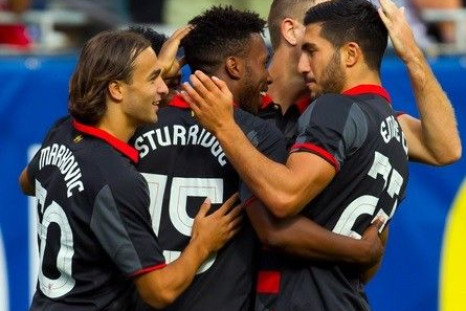 Liverpool FC player Daniel Sturridge (center) celebrates their goal against Olympiacos during the first half at Soldier Field.