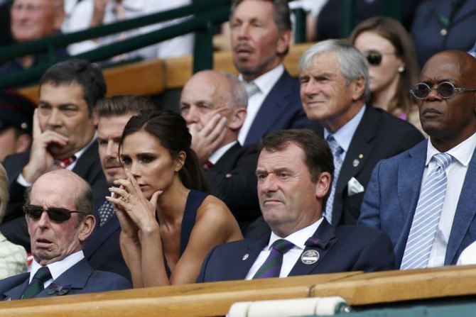 Victoria Beckham (C) watches the men&#039;s singles final tennis match between Novak Djokovic of Serbia and Roger Federer of Switzerland on Centre Court at the Wimbledon Tennis Championships, in London July 6, 2014