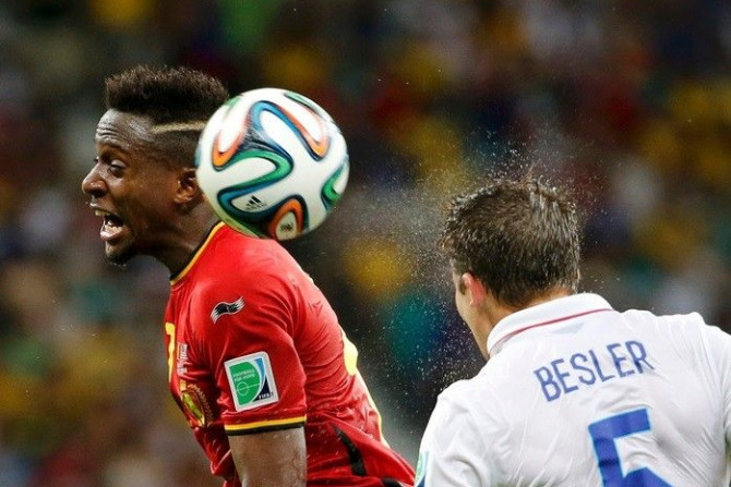 Belgium&#039;s Divock Origi jumps for the ball with Matt Besler of the U.S. during their 2014 World Cup round of 16 game at the Fonte Nova arena in Salvador July 1, 2014.