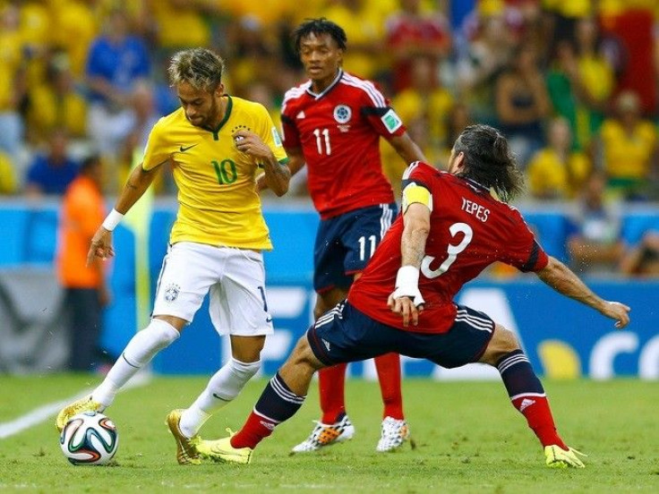 (L-R) Brazil&#039;s Neymar fights for the ball with Colombia&#039;s Juan Cuadrado and Mario Yepes during their 2014 World Cup quarter-finals at the Castelao arena in Fortaleza July 4, 2014.
