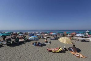 People Sunbath at Ostia beach.