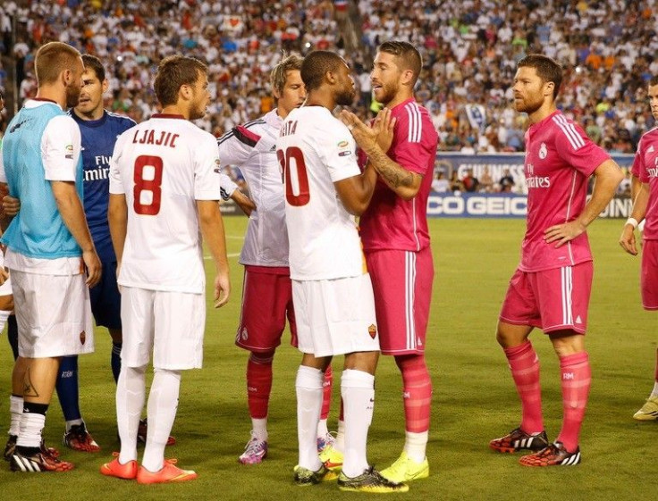 Real Madrid defender Sergio Ramos (4) argues with Roma midfielder Seydou Keita (20) before the game at Cotton Bowl Stadium.