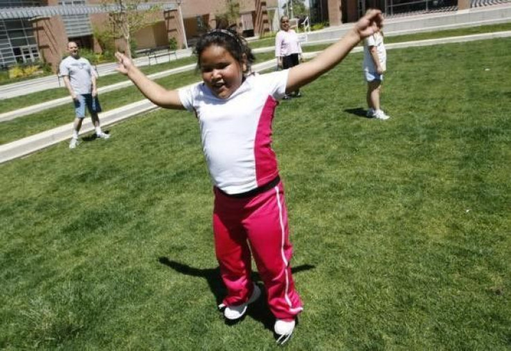 Fernanda Garcia-Villanueva, 8, does jumping jacks at a group exercise session in the 10-week Shapedown Program at The Children&#039;s Hospital in Aurora, Colorado May 29, 2010.