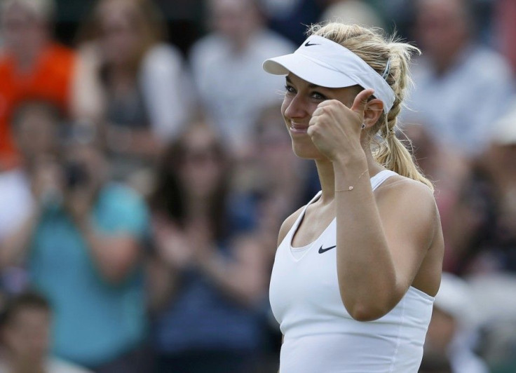 Sabine Lisicki of Germany reacts after defeating Yaroslava Shvedova of Kazakhstan in their women&#039;s singles tennis match at the Wimbledon Tennis Championships