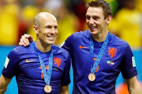 Arjen Robben (L) and Stefan de Vrij of the Netherlands celebrate after winning their 2014 World Cup third-place playoff against Brazil at the Brasilia national stadium in Brasilia July 12, 2014.