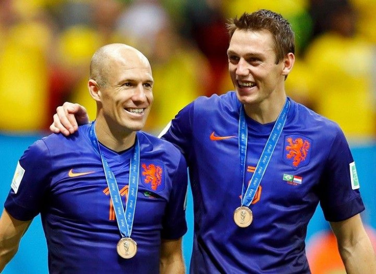 Arjen Robben (L) and Stefan de Vrij of the Netherlands celebrate after winning their 2014 World Cup third-place playoff against Brazil at the Brasilia national stadium in Brasilia July 12, 2014.