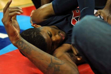 USA Team Blue guard Paul George lays on the floor after injuring his leg during the USA Basketball Showcase at Thomas & Mack Center.
