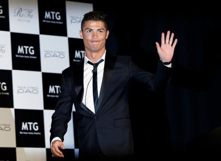 Real Madrid&#039;s Cristiano Ronaldo of Portugal waves upon arriving for a promotional event in Tokyo July 22, 2014. Ronaldo said on Tuesday he is focused on having another successful season after a disappointing campaign in the 2014 World Cup in Brazil.
