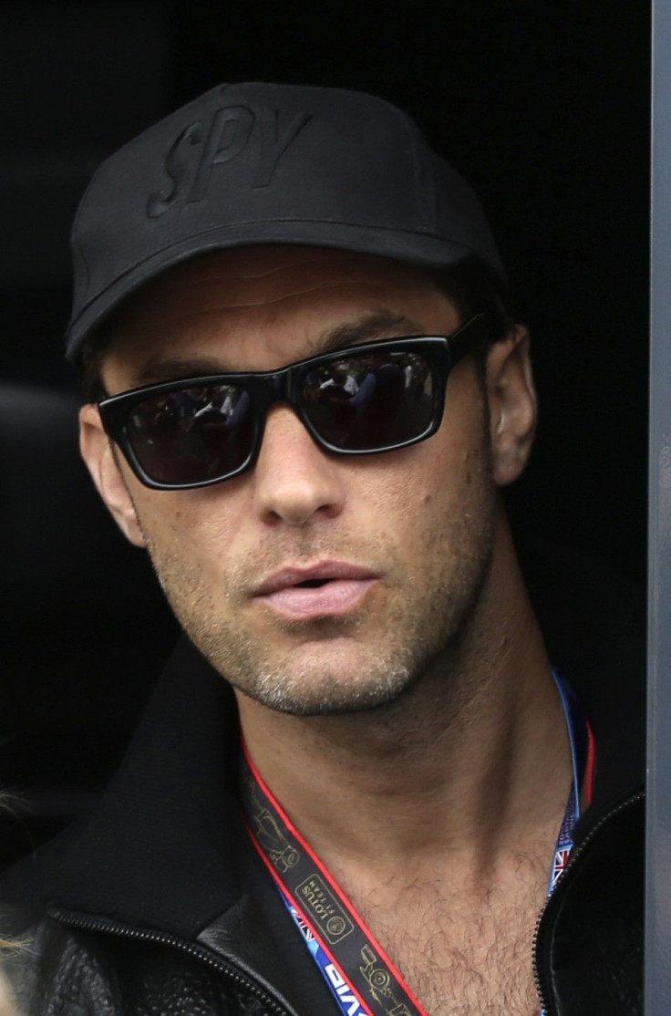 British actor Jude Law arrives at the paddock ahead of the British Grand Prix at the Silverstone Race Circuit, central England, July 6, 2014.