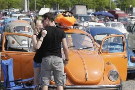 A couple kiss as they attend the 29th annual &quot;MaiKaeferTreffen&quot; (May Beetle meeting) meeting in Hanover, May 1, 2012.