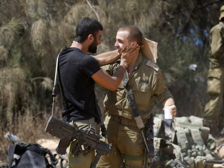 Israeli soldiers from the Givati brigade embrace