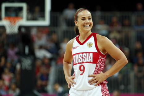 Russia&#039;s Becky Hammon smiles toward her bench during the women&#039;s preliminary round Group B basketball match against Brazil at the Basketball Arena during the London 2012 Olympic Games in this file photo taken July 30, 2012. A glass ceiling in ma