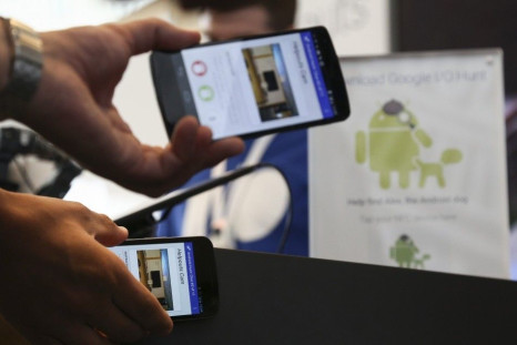 ATTENDEES PLAY A CHECK-IN GAME TO WIN PRIZES BY TAPPING THEIR NFC-ENABLED ANDROID SMARTPHONES AT THE GOOGLE I/O DEVELOPERS CONFERENCE IN SAN FRANCISCO