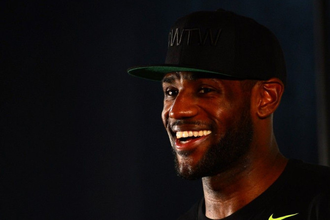 Aug 8, 2014; Akron, OH, USA; Cleveland Cavaliers forward LeBron James talks with the media during the LeBron James Family Foundation Reunion and Rally at InfoCision Stadium.