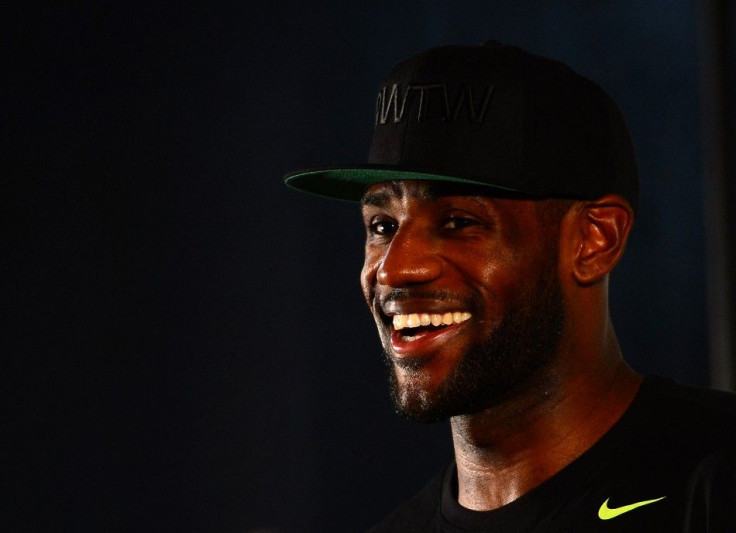 Aug 8, 2014; Akron, OH, USA; Cleveland Cavaliers forward LeBron James talks with the media during the LeBron James Family Foundation Reunion and Rally at InfoCision Stadium.