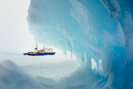 The MV Akademik Shokalskiy is pictured stranded in ice in Antarctica, December 29, 2013. Fog and heavy snow mean the 74 passengers on the Russian ship stranded in Antarctica for over a week are likely to ring in the New Year trapped in the ice, as a rescu