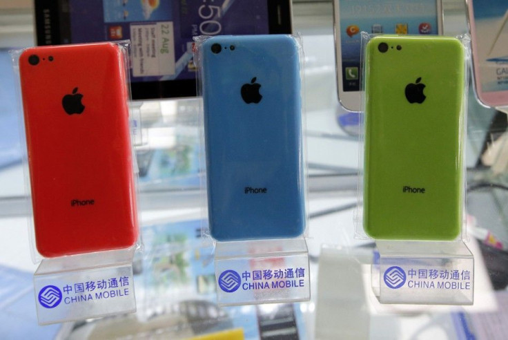 Apple&#039;s iPhone 5Cs phones are displayed on racks
