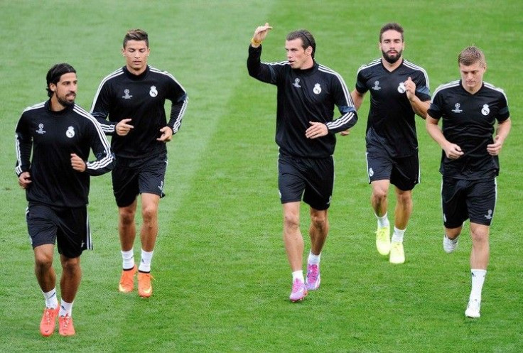 (L to R) Real Madrid's Sami Khedira, Cristiano Ronaldo, Gareth Bale, Daniel Carvajal and Toni Kroos attend a training session ahead of their UEFA Super Cup soccer match against Sevilla at Cardiff City Stadium, Wales, August 11, 2014.