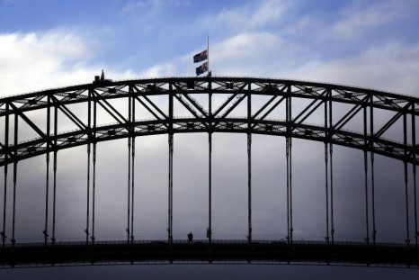 Australian flags fly at half-mast atop the Sydney Harbour Bridge as a sign of respect for those killed in the Malaysia Airlines MH17 crash