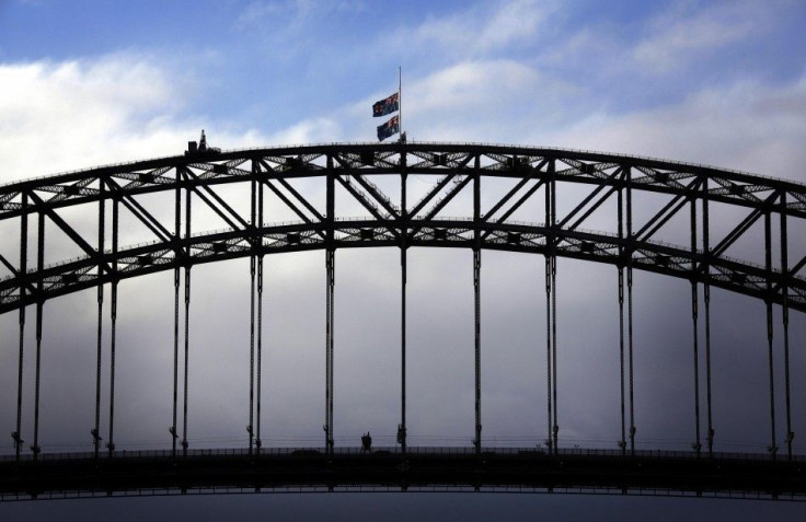 Australian flags fly at half-mast atop the Sydney Harbour Bridge as a sign of respect for those killed in the Malaysia Airlines MH17 crash