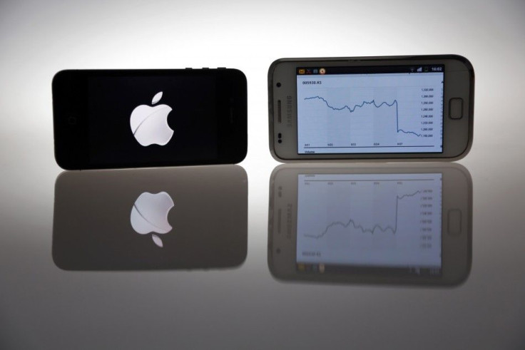 An Apple IPhone 4s and Samsung Galaxy S are seen in this illustration photo