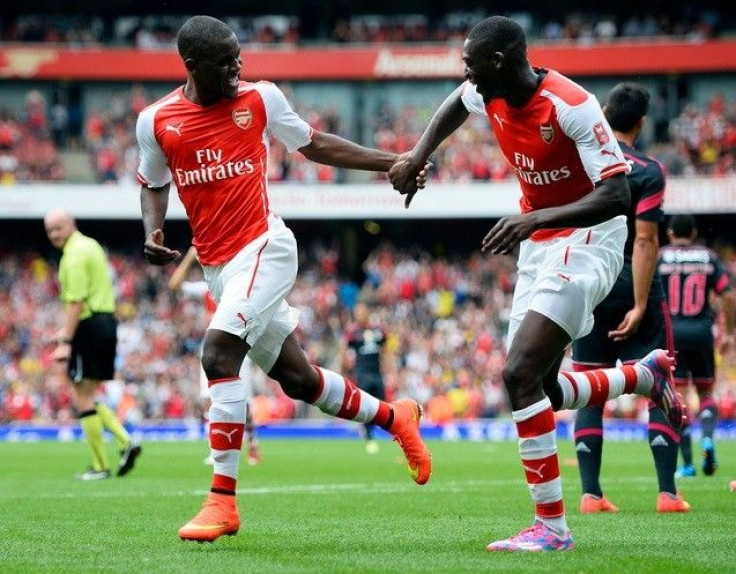 Arsenal&#039;s Yaya Sanogo (R) celebrates after teammate Joel Campbell (L) scored against Benfica during their Emirates Cup soccer match at the Emirates stadium in London August 2, 2014.