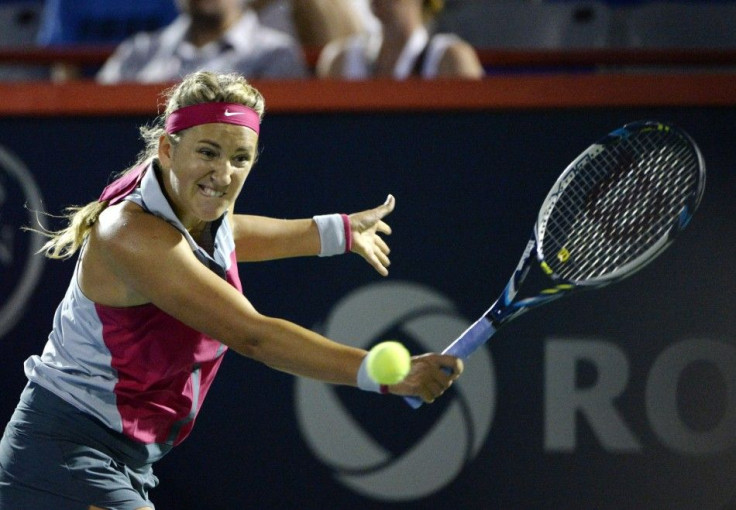 Victoria Azarenka (BLR) hits a backhand against Agnieszka Radwanska (POL)